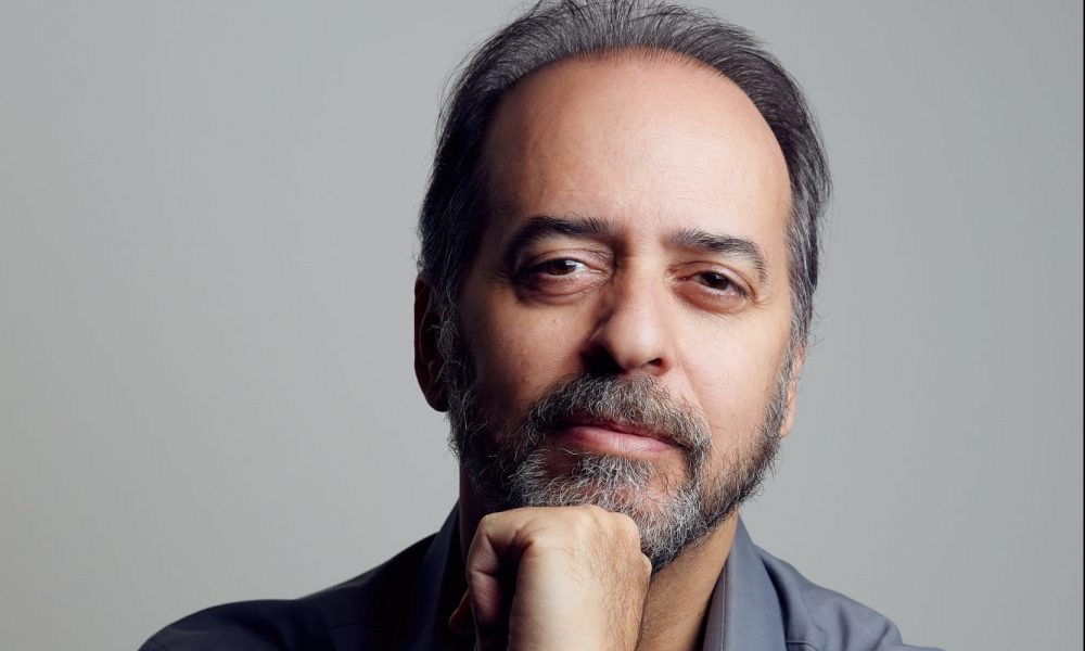 Headshot of music supervisor Adonis Tsilimparis